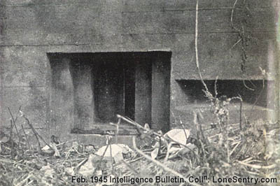 [Closeup of center machine-gun embrasure, measuring 8 by 12 inches, showing closure plate partly closed.]